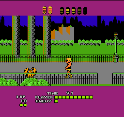 Bad Street Brawler: Duke walks along a sidewalk in front of a city skyline, with a time counter and player and enemy health bars