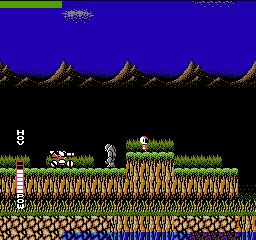 Blaster Master: the tank drives across a rocky alien surface with the hover and power meters at left and Jason's enemy beside it