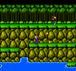 Contra: a commando fires across a rocky jungle ledge while a soldier runs along the ridge above and water ripples below
