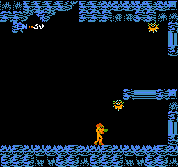 Metroid: Samus stands in a blue cavern with energy at 30 as two spiky creatures hover nearby