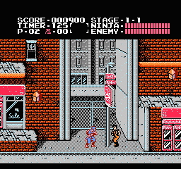 Ninja Gaiden: Ryu hangs from a pole on a brick city street while a thug approaches, with the stage, timer and health bars at the top
