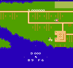 Raid on Bungeling Bay: the helicopter flies over the island coast while a factory and roads sit on the map