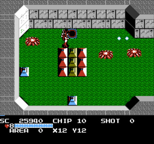 The Guardian Legend: the robot guardian in a green arena with gray walls faces red spider creatures, with the chip count and area readout below